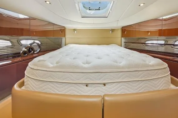 Slide: The Image of Luxurious bedroom interior of 2008 Sea Ray 47 Sedan Bridge yacht with plush mattress. - 33