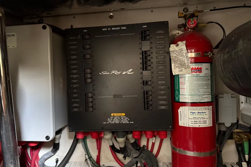 Slide: The Image of Electrical panel and fire extinguisher in 2008 Sea Ray 47 Sedan Bridge yacht. - 38
