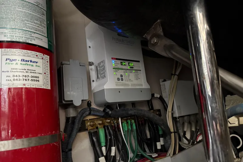 Slide: The Image of Electrical panel and fire extinguisher on 2008 Sea Ray 47 Sedan Bridge yacht. - 40