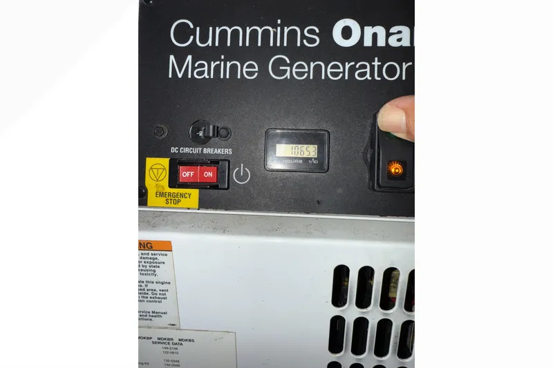 Slide: The Image of Cummins Onan marine generator control panel on 2008 Sea Ray 47 Sedan Bridge. - 44