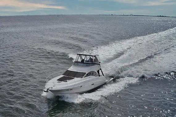 Slide: The Image of 2008 Sea Ray 47 Sedan Bridge yacht cruising on open water. - 6