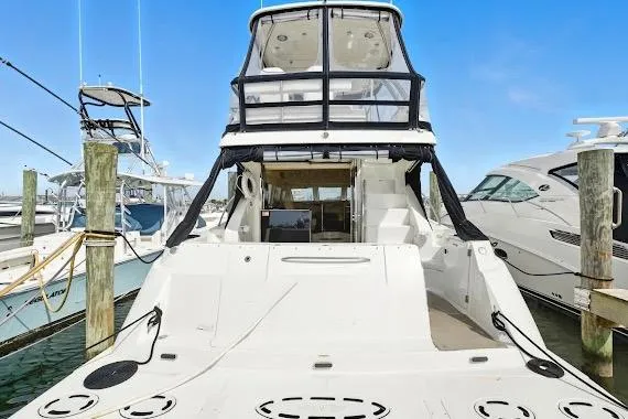 Slide: The Image of 2008 Sea Ray 47 Sedan Bridge yacht docked at marina, rear view. - 8