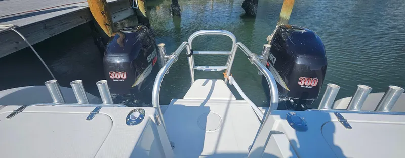 Slide: The Image of 2008 World Cat 320 EC boat with twin 300 horsepower engines at dock. - 12