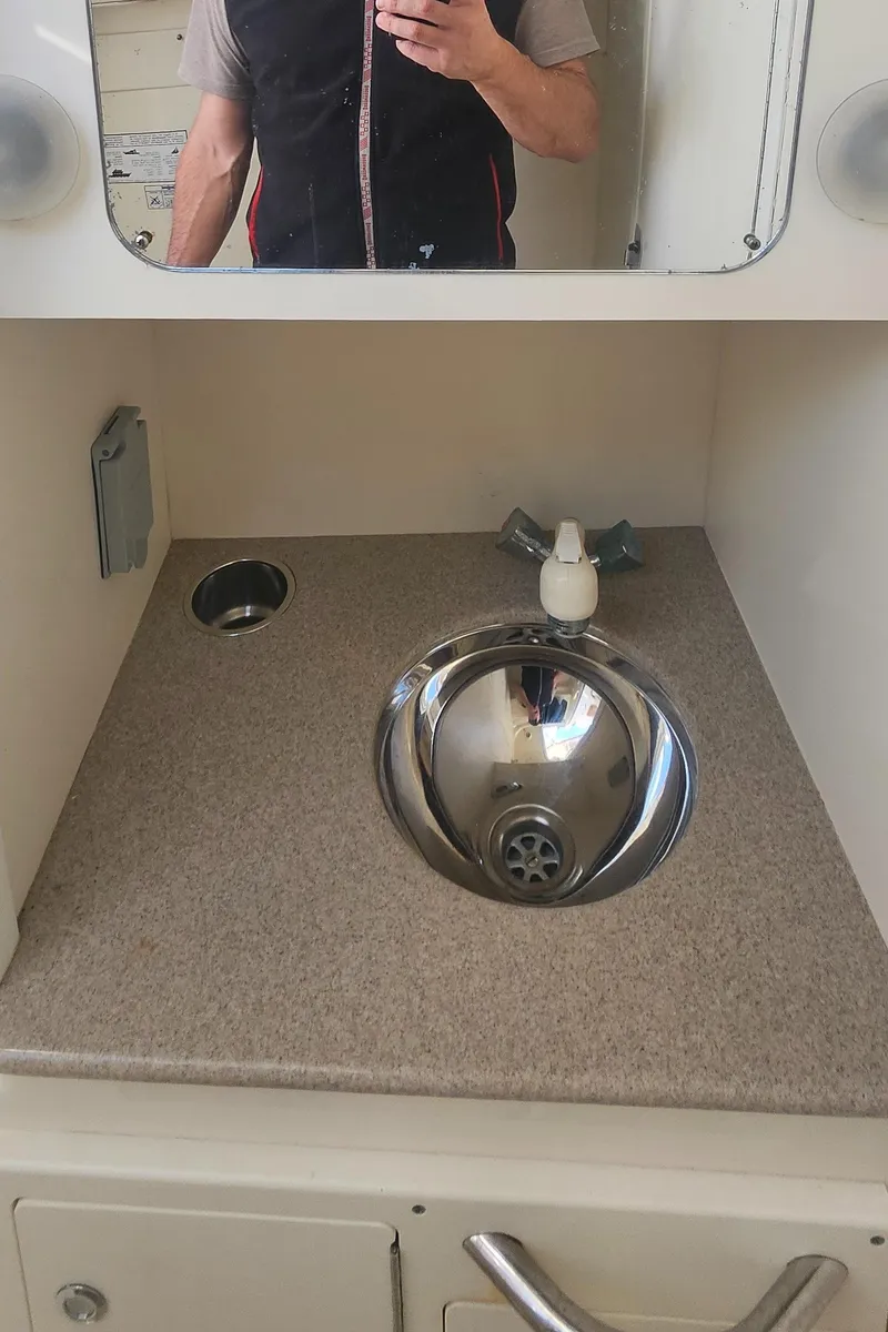 Slide: The Image of 2008 World Cat 320 EC bathroom sink with mirror and countertop. - 30