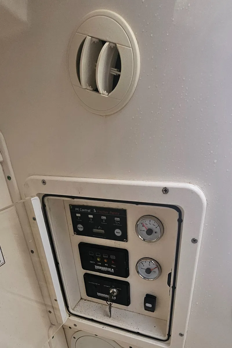 Slide: The Image of Control panel on a 2008 World Cat 320 EC boat interior. - 32