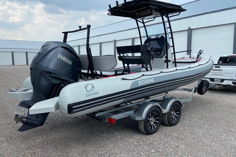 The Image of 2023 Zodiac Pro Open boat with Yamaha engine on trailer, parked outdoors. - 1