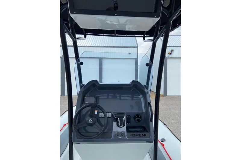 Slide: The Image of 2023 Zodiac Pro Open boat console with steering wheel and controls. - 10
