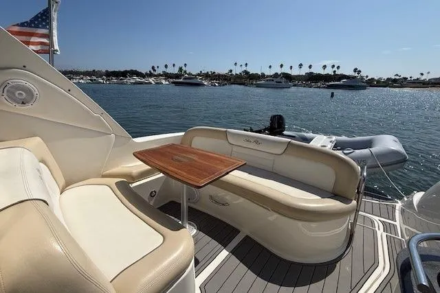 Slide: The Image of Luxury seating on 2012 Sea Ray 330 Sundancer yacht, docked with scenic harbor view. - 10