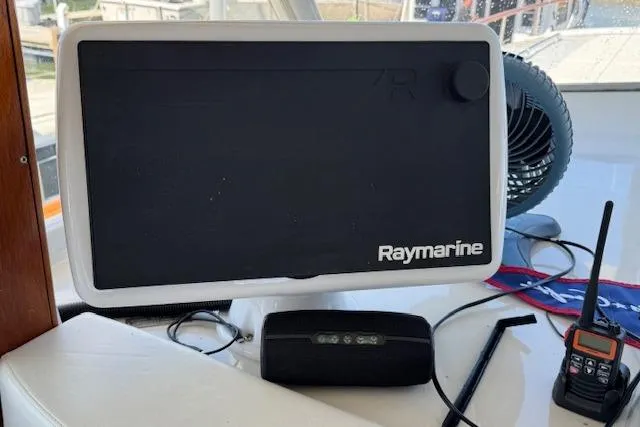 Slide: The Image of Raymarine navigation system on 1974 Chris-Craft 47 Commander yacht dashboard. - 17