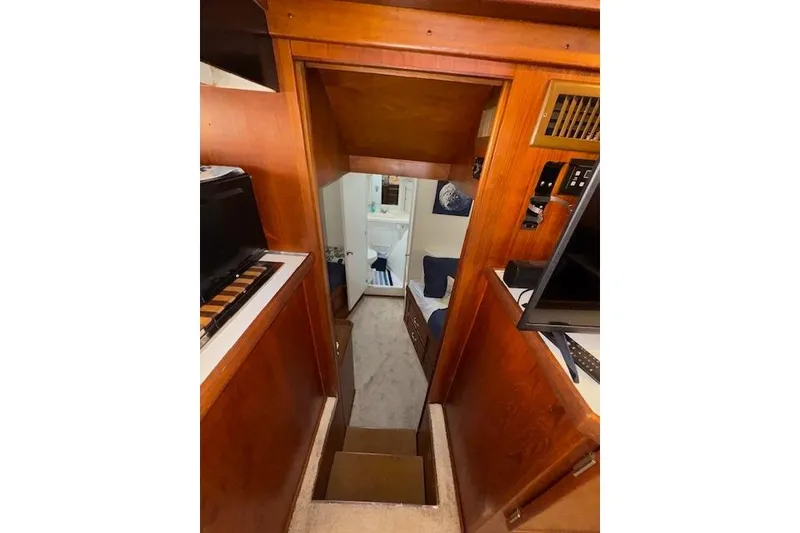 Slide: The Image of 1974 Chris-Craft 47 Commander interior with wood paneling and cozy cabin view. - 41