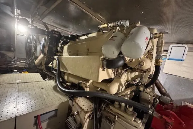 Slide: The Image of Engine room of 1974 Chris-Craft 47 Commander with visible machinery and components. - 49