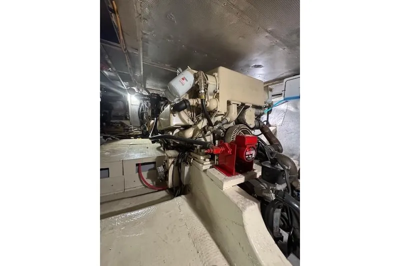 Slide: The Image of Engine room of 1974 Chris-Craft 47 Commander with visible machinery and components. - 51