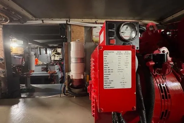 Slide: The Image of Engine room of a 1974 Chris-Craft 47 Commander with visible gauges and equipment. - 53