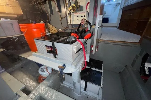 Slide: The Image of Engine room of 1974 Chris-Craft 47 Commander with batteries and equipment. - 54