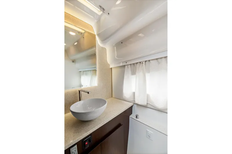 Slide: The Image of Luxurious bedroom interior of 2016 Regal 42 Grande Coupe yacht with elegant wood accents. - 18