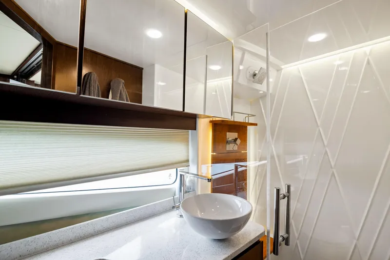 Slide: The Image of Luxurious bedroom interior of 2016 Regal 42 Grande Coupe yacht with modern amenities. - 19