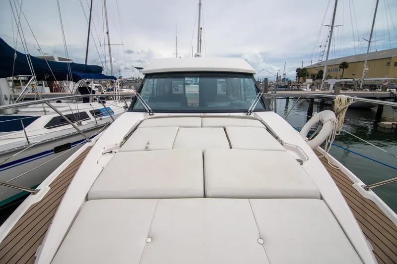 Slide: The Image of Luxurious interior of 2016 Regal 42 Grande Coupe yacht with sofa and TV. - 21