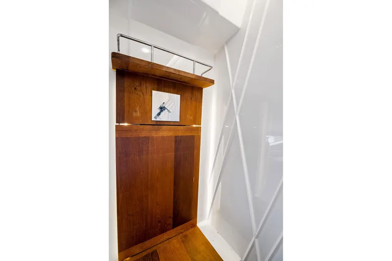 Slide: The Image of Wooden interior detail of a 2016 Regal 42 Grande Coupe yacht with modern design elements. - 28