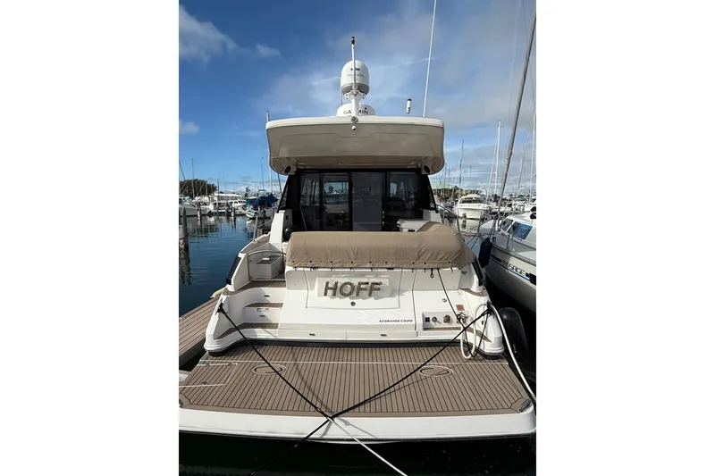 Slide: The Image of 2017 Regal 42 Grande Coupe yacht docked at marina, rear view. - 29