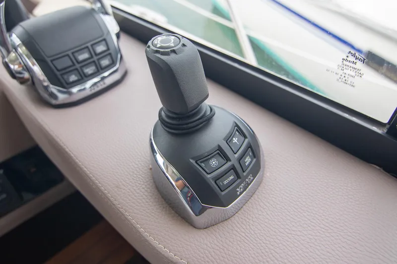 Slide: The Image of Helm of 2016 Regal 42 Grande Coupe with navigation display and controls. - 9