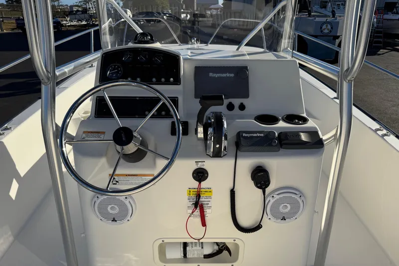Slide: The Image of 2017 Boston Whaler 210 Montauk boat console with steering wheel and navigation equipment. - 10