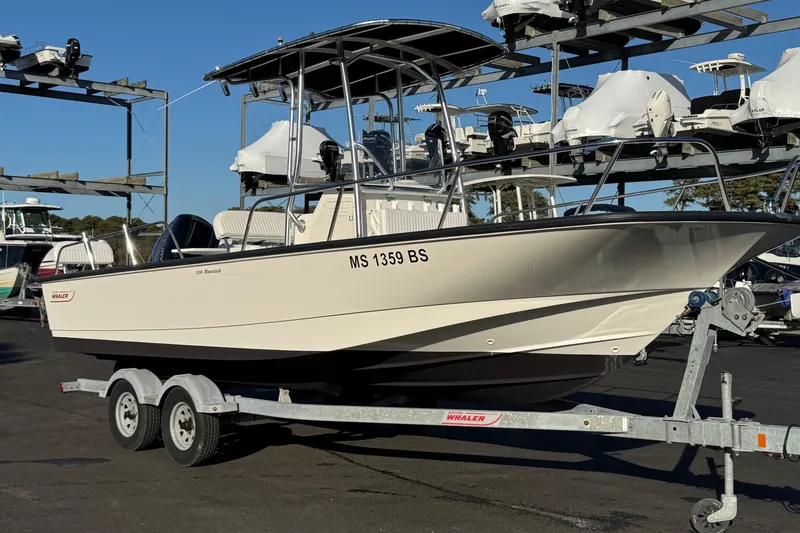 Slide: The Image of 2017 Boston Whaler 210 Montauk boat on trailer in marina storage area. - 3