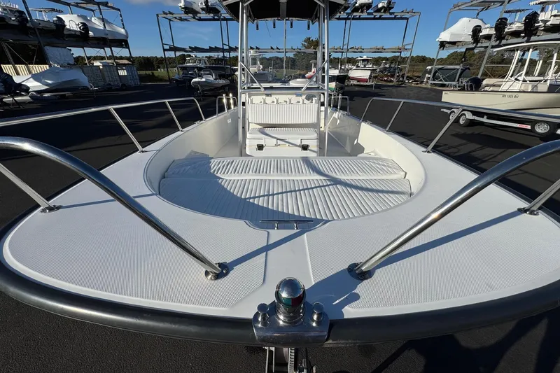 Slide: The Image of 2017 Boston Whaler 210 Montauk boat deck with seating, docked in a marina. - 5