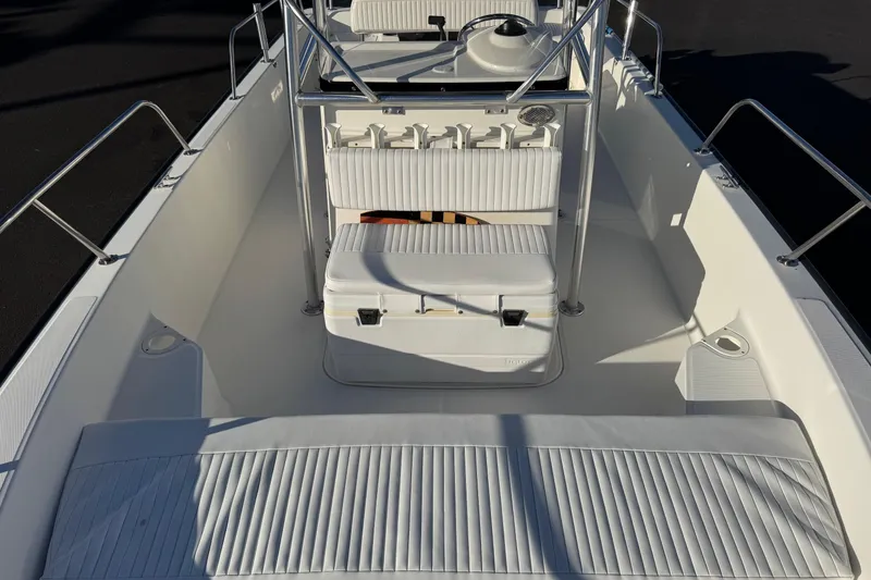 Slide: The Image of 2017 Boston Whaler 210 Montauk boat interior with seating and storage. - 7