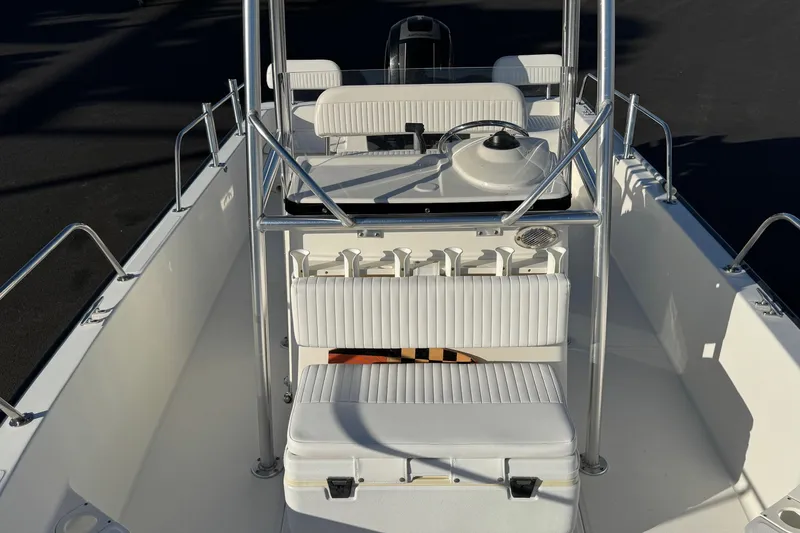 Slide: The Image of 2017 Boston Whaler 210 Montauk boat interior with seating and steering console. - 8