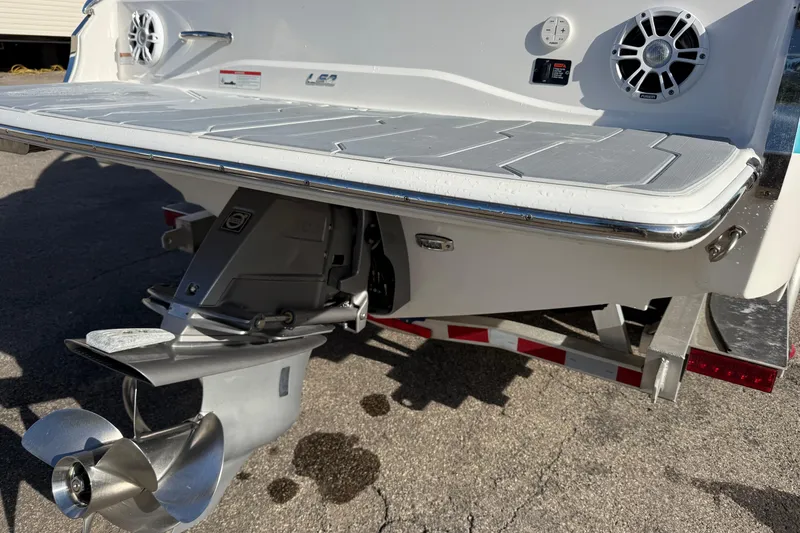 Slide: The Image of 2022 Regal LS2 boat stern with propeller and speakers, on a trailer. - 18