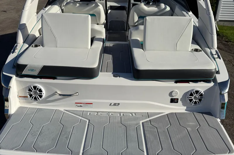 Slide: The Image of 2022 Regal LS2 boat with white seating and modern design features. - 20