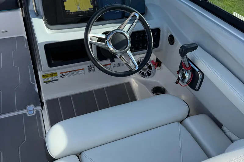 Slide: The Image of 2022 Regal LS2 boat interior with steering wheel and control panel. - 6