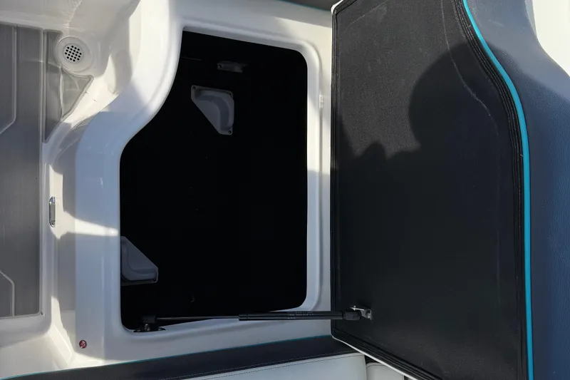 Slide: The Image of 2022 Regal LS2 boat storage compartment with open hatch and sleek interior design. - 9