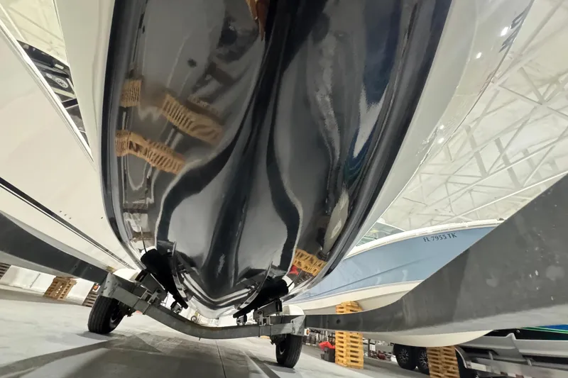 Slide: The Image of 1989 Glastron/Carlson 19 CSS boat hull, viewed from below, in a storage facility. - 10