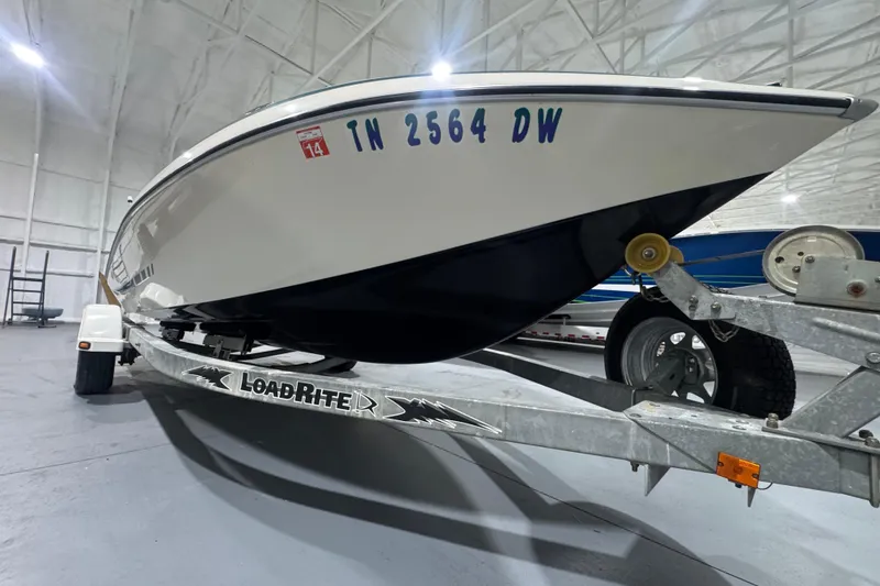 Slide: The Image of 1989 Glastron/Carlson 19 CSS boat on LoadRite trailer in indoor storage facility. - 11
