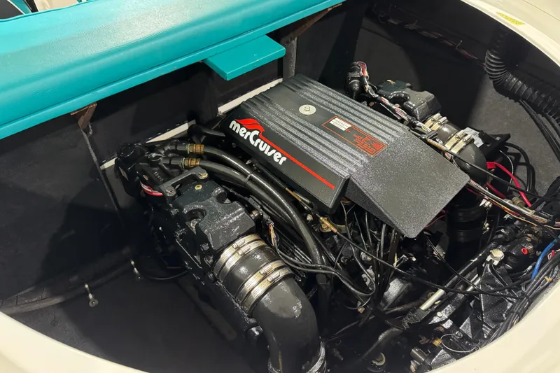 Slide: The Image of 1989 Glastron/Carlson 19 CSS boat engine compartment with MerCruiser engine. - 15