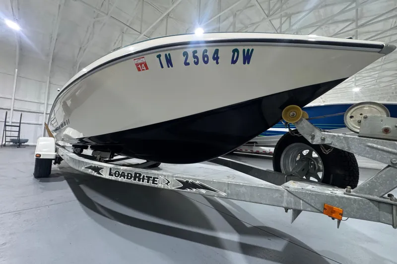 Slide: The Image of 1989 Glastron/Carlson 19 CSS boat on LoadRite trailer in indoor storage. - 4