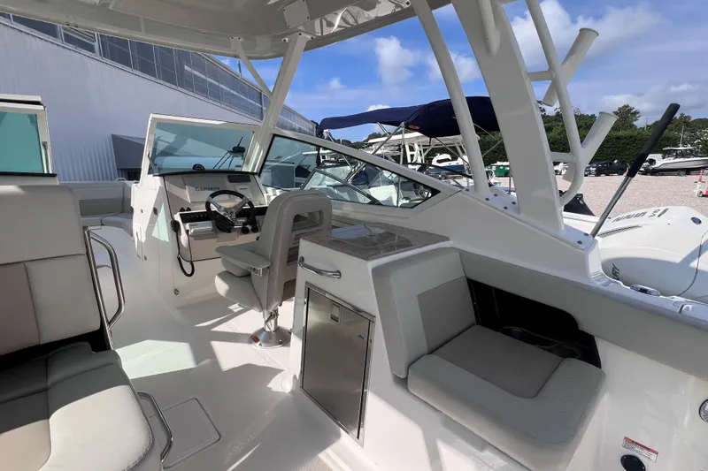 Slide: The Image of 2021 Boston Whaler 280 Vantage boat interior with helm, seating, and modern amenities. - 10