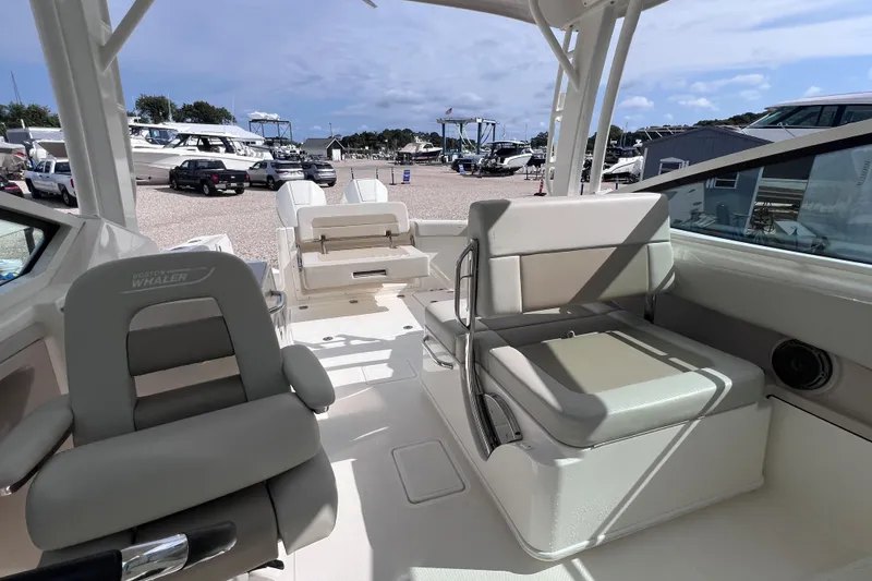 Slide: The Image of Interior view of 2021 Boston Whaler 280 Vantage boat with seating and helm. - 13