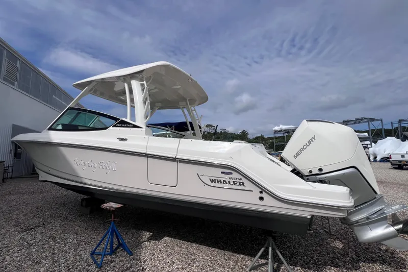 Slide: The Image of 2021 Boston Whaler 280 Vantage boat with Mercury engine on display outdoors. - 22