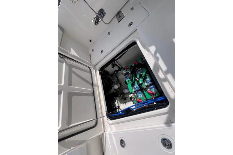 Slide: The Image of Open hatch of 2021 Boston Whaler 280 Vantage showing internal components and wiring. - 9