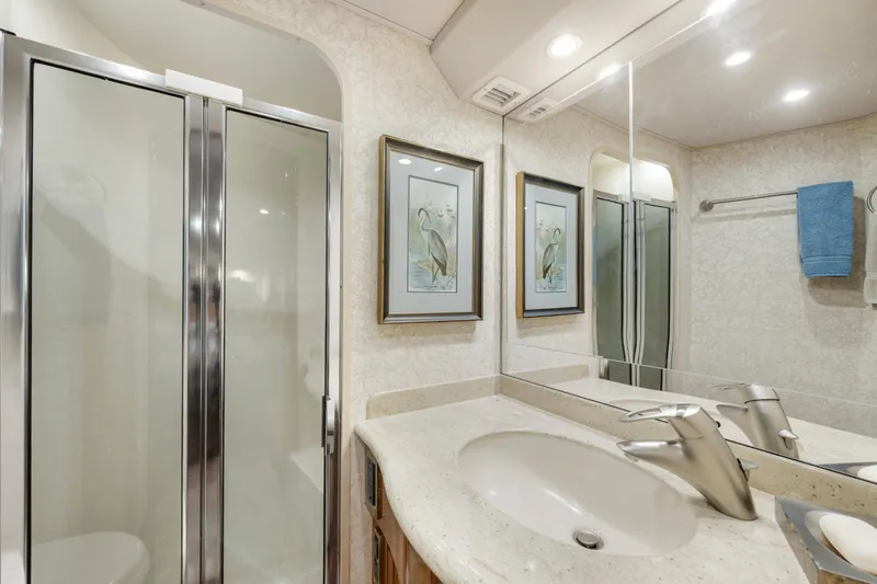 Slide: The Image of Luxurious bathroom in 2009 Viking 50 Convertible yacht with shower and elegant decor. - 25