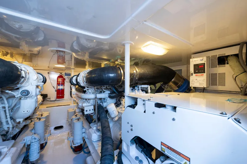 Slide: The Image of Engine room of 2009 Viking 50 Convertible yacht, featuring machinery and equipment. - 31