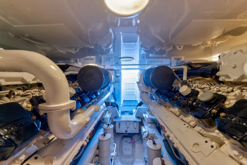 Slide: The Image of Engine room of 2009 Viking 50 Convertible yacht, showcasing dual engines and mechanical components. - 38