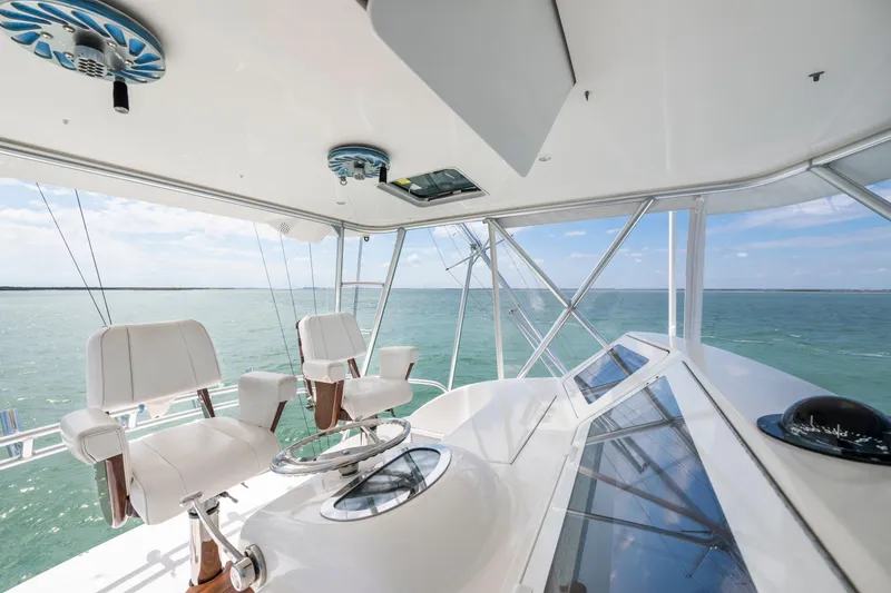 Slide: The Image of Interior view of 2009 Viking 50 Convertible yacht helm with ocean backdrop. - 4