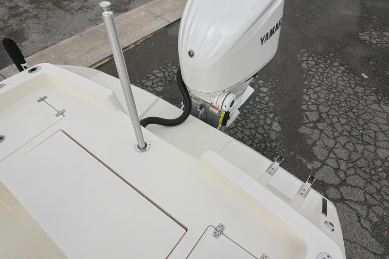 Slide: The Image of 2026 Pathfinder 2400 TRS boat with Yamaha outboard motor on cracked pavement. - 11