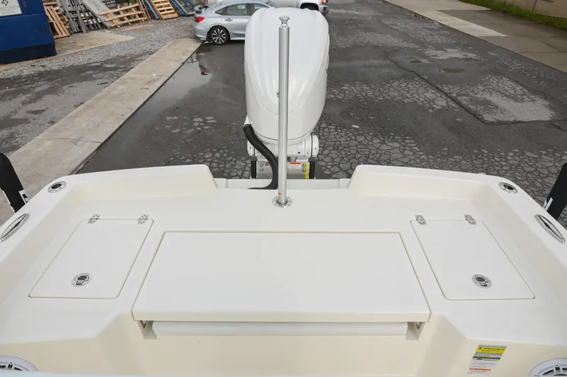 Slide: The Image of 2026 Pathfinder 2400 TRS boat stern view with motor and storage compartments. - 12