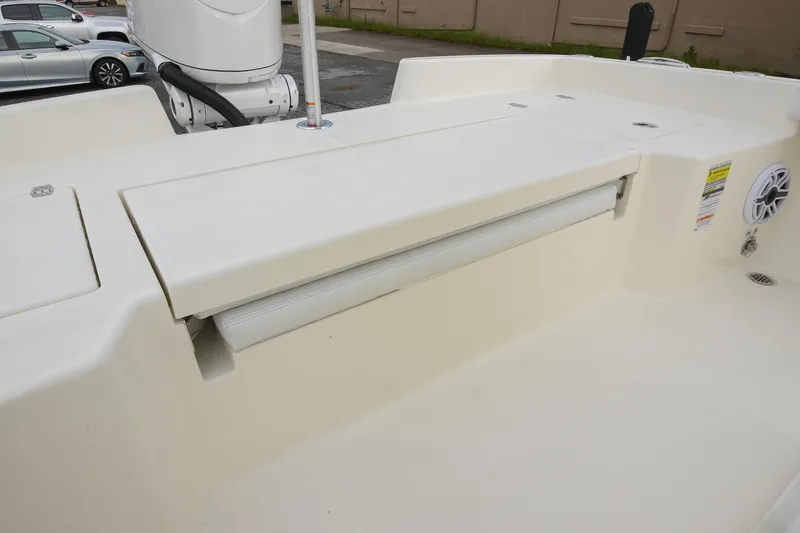 Slide: The Image of 2026 Pathfinder 2400 TRS boat interior with storage compartment and speaker. - 13