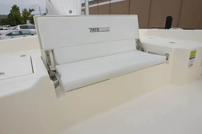 Slide: The Image of 2026 Pathfinder 2400 TRS boat with white cushioned seating. - 14