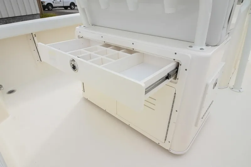 Slide: The Image of 2026 Pathfinder 2400 TRS boat with open storage drawer and compartments. - 18